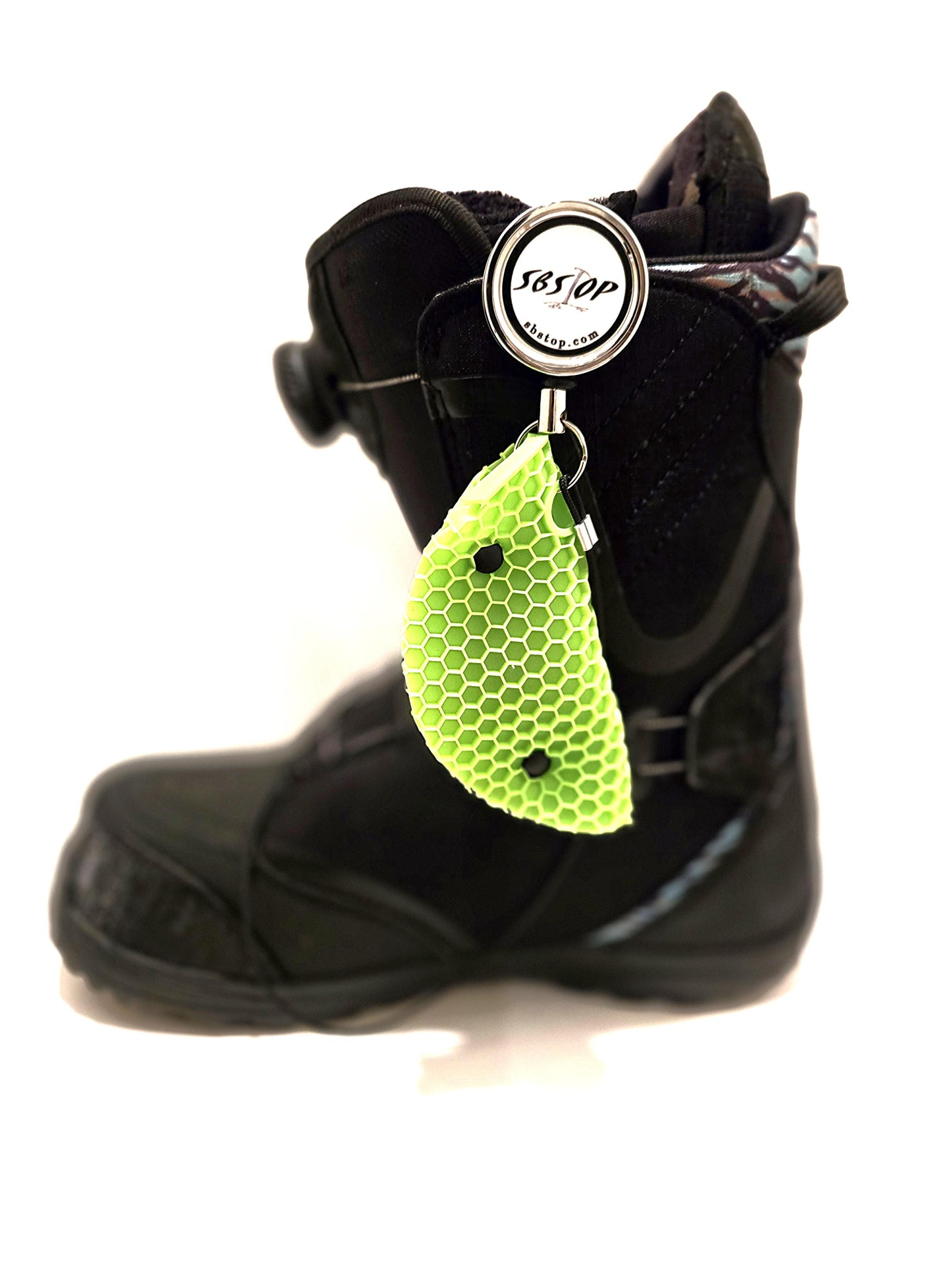 Snowboard rider launching with SBStop Taco Pad installed for stability