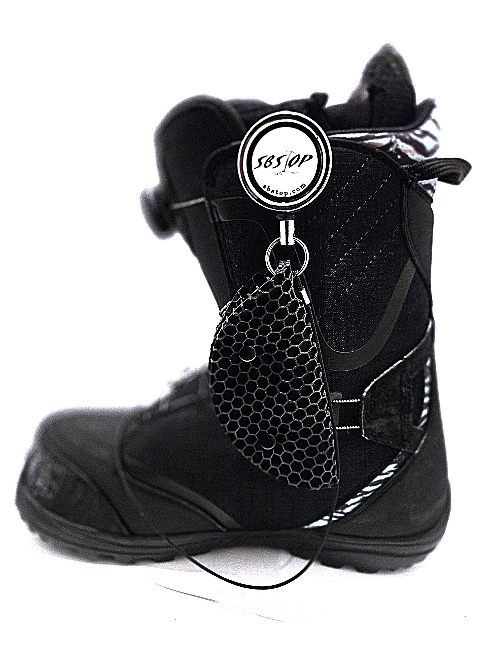 Snowboard rider launching with SBStop Taco Pad installed for stability